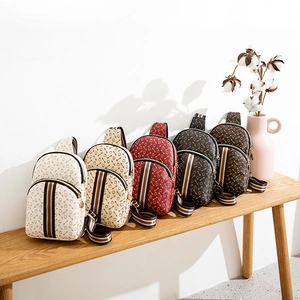 Chic PU leather chest bags with vintage horseshoe print and colorful striped straps