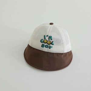 Close-up of breathable mesh fabric and 'I'M COOL BOY' embroidery on a kids sun hat