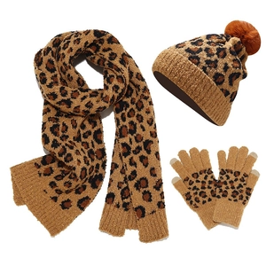 Winter leopard print knit set with pompom beanie, scarf, and touchscreen gloves in camel