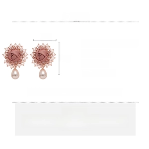 Detail view of pink floral pearl drop earrings with size specs and material info