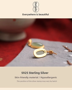 Detail shot of Hetian jade earrings showing the S925 sterling silver hallmark stamp