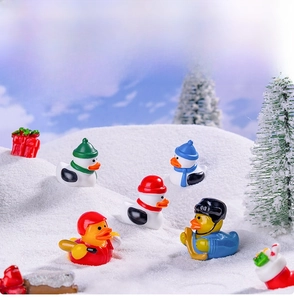 Detailed view of miniature Christmas ducks in winter sports gear for DIY holiday decor