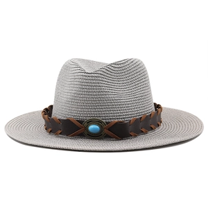 Detail of gray straw fedora hat with turquoise gemstone and vintage leather band