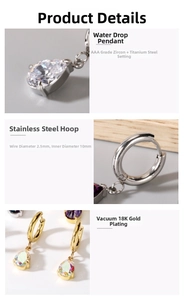 Macro detail of titanium steel hoop earrings with AAA cubic zirconia teardrop charm
