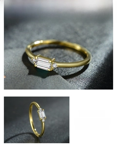 Macro shot of s925 silver gold ring featuring a rectangular zircon and side stones