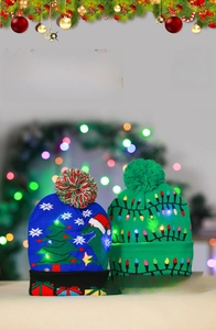 Detail of LED knitted Christmas hats featuring glowing dinosaur and festive patterns