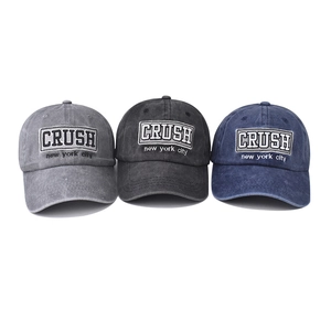 Classic washed cotton baseball cap with CRUSH embroidery in charcoal, navy, and smoke gray