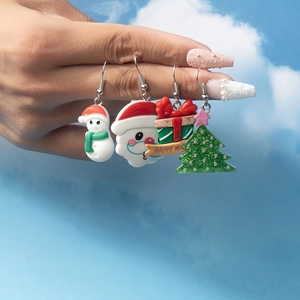 Set of 4 Christmas acrylic earrings featuring Santa, Snowman, Gift and Tree motifs