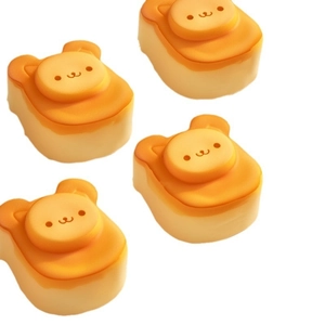 Detailed view of four bear-shaped silicone molds for DIY cheese cakes and puddings