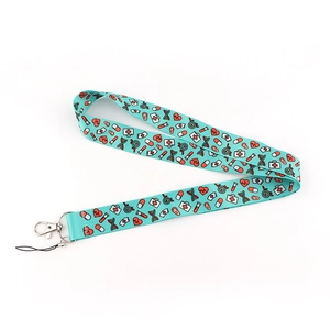 Close-up of cyan medical lanyard featuring heart and syringe patterns with metal clip