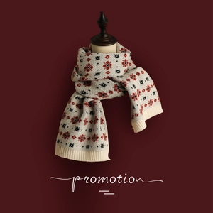 Nordic knit winter scarf with retro red snowflake pattern on cream background
