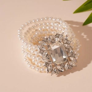 Detail of multi-layer pearl bracelet featuring a vintage crystal rectangle centerpiece