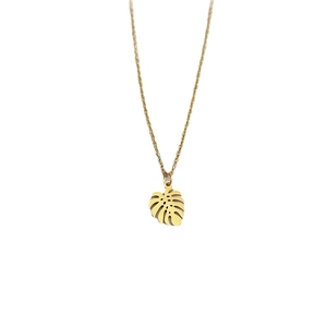 Elegant gold titanium steel necklace featuring a tropical leaf pendant and delicate chain