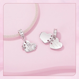 Macro view of S925 sterling silver heart locket charm with engraved to-do-list detail