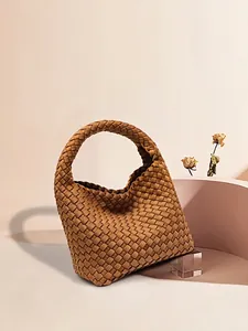 Brown hand-woven hobo bag with wide stripe texture and integrated handle design