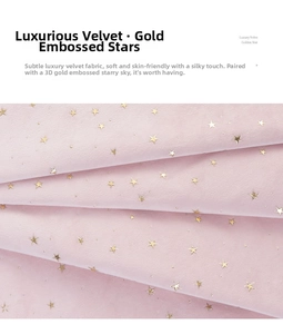 Detailed view of pink velvet pouch fabric with gold stamped star pattern and soft texture