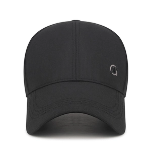 Classic black baseball cap with curved brim and small metal logo on white background