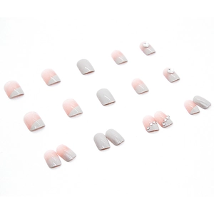 Pink and grey gradient press-on nails with 3D heart rhinestones in a 24-piece set