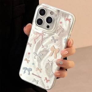Close-up of clear phone case featuring stylish bow and butterfly patterns with Bunny Case text