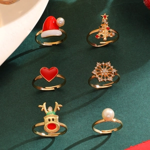 Detail view of 6pcs Christmas ring set with enamel Santa hat, tree and reindeer icons