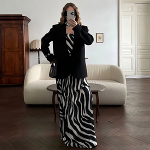 Chic long sleeve black blazer jacket styled over a zebra print maxi dress outfit