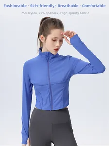 Detail of blue slim-fit zip yoga jacket showing high-stretch nylon fabric and thumb holes