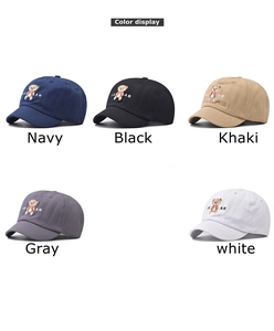 Detail showing bear embroidery on baseball caps in navy, black, khaki, gray, and white