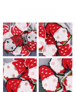 Macro details of Santa Gnome chenille embroidery patch with soft 3D textured surface