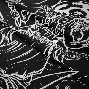 Detailed close-up of Gothic black and white tapestry showing moon and bone illustrations