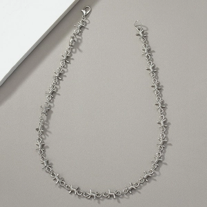 Hip hop punk style silver thorn chain necklace for men and women on gray and white background