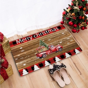 Macro detail of Christmas flannel door mat featuring a vintage red truck and snowflakes