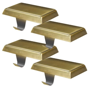 Close-up of four heavy-duty bronze and silver fireplace mantle stocking hangers