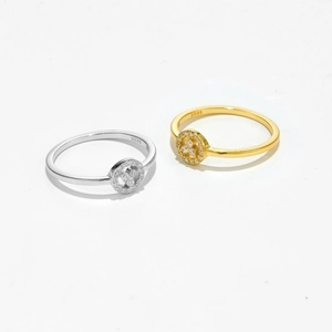 Macro shot showing S925 hallmark on silver and gold plated rings with zircon inlay
