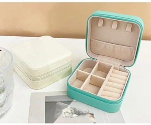 Detail view of portable PU leather jewelry box showing interior dividers and zip closure