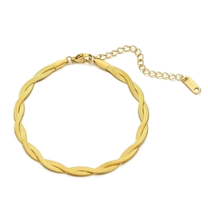 Elegant gold-tone twisted snake bone bracelet in stainless steel with lobster clasp