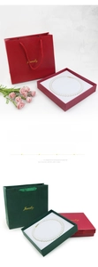 Detail of luxury jewelry gift box and paper shopping bag with golden Jewelry text