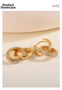 Detail of 18K gold-plated stainless steel hoop earrings with sparkling zircon inlay