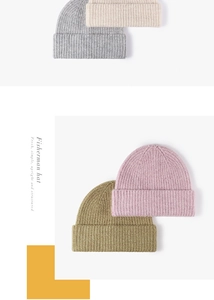 Detailed view of coarse ribbed texture on thick winter knitted beanies in various colors