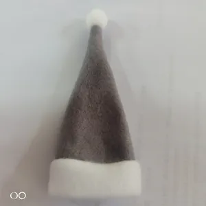 Close-up of mini grey felt Christmas hat with white pompom and plush trim for bottle decor