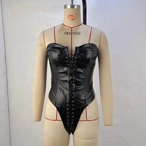 Detail of black PU leather bodysuit featuring lace-up grommet tie front design