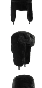 Detail view of black faux fur trapper hat with ear flaps and adjustable chin buckle