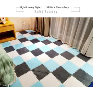 Detail of plush puzzle floor mats in white, light blue, and grey checkered pattern