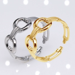 Detailed view of adjustable chain rings in gold and silver finish with high metal luster
