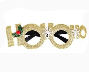 Close-up of Ho Ho Ho Christmas party glasses with gold glitter and holly leaves
