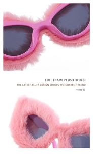 Detailed macro view of the pink plush cat-eye sunglasses frame and soft faux fur texture