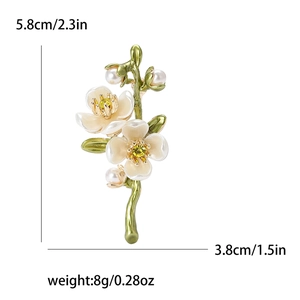 Green plum blossom branch brooch with white flowers and pearls on white background