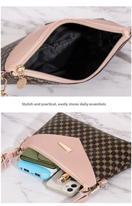 Detail showing inner compartments of a floral pattern bag with pink leather trim