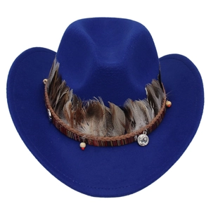 Detail of royal blue western cowboy hat with ethnic feather and beaded decorative band