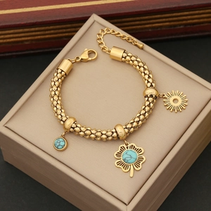 Exaggerated stainless steel necklace featuring turquoise floral charms and sun pendants