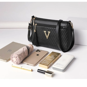 Women's black leather crossbody bag stylish chevron quilted shoulder bag with metal V logo.
